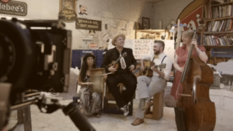 Jack Norton sings at sign painter Mike Meyer's studio in Mazeppa, Minnesota.