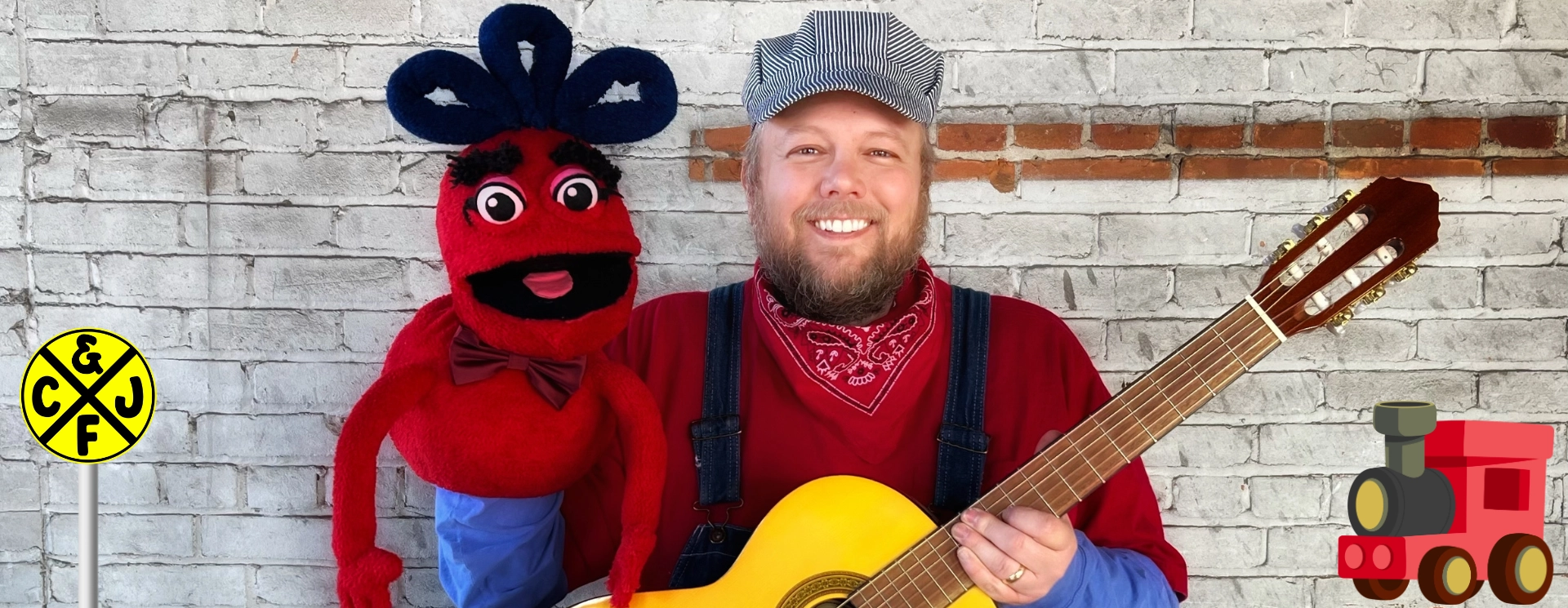 Children's folk musician Conductor Jack with acoustic guitar and his puppet sidekick Naybob