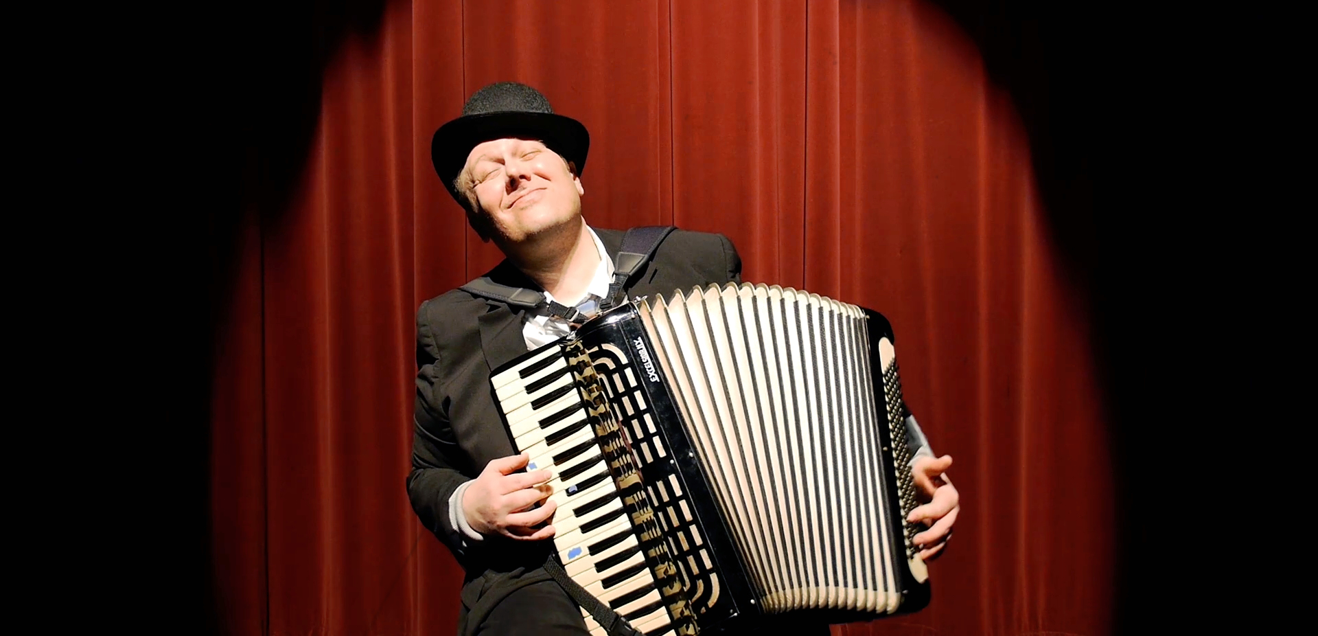 Jack Norton on stage with accordion